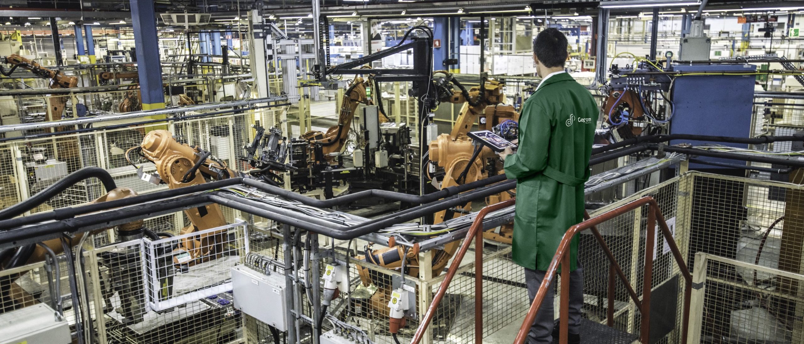 Engineer overseeing automated production process in a factory